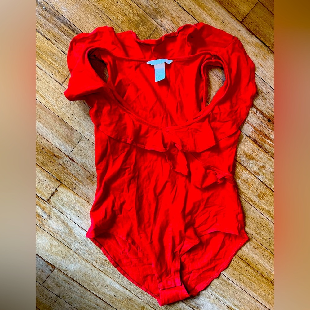 Gorgeous red bodysuit. Perfect for hot summer nights. Worn once, size medium.